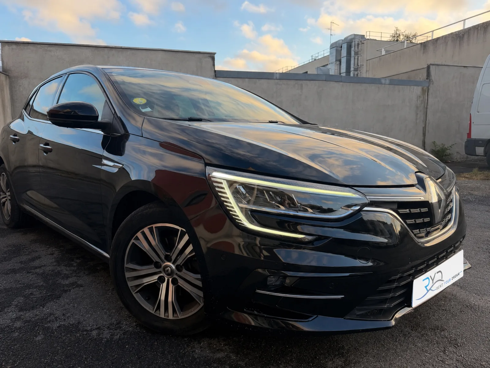 Black Rent Your Dream Renault Mégane 4, low-angle front view